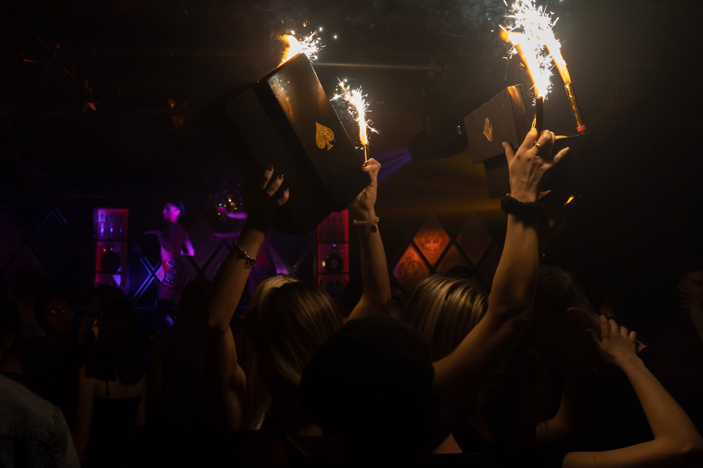 Party in a nightclub with boxes and lightsparks